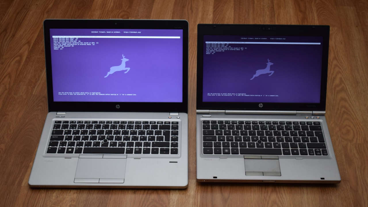 Two HP EliteBooks side by side, both running Libreboot